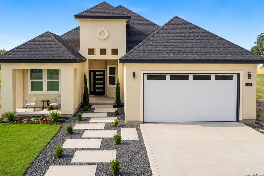 Front exterior of a new home in , Atascosa, TX, highlighting curb appeal (Image 27).