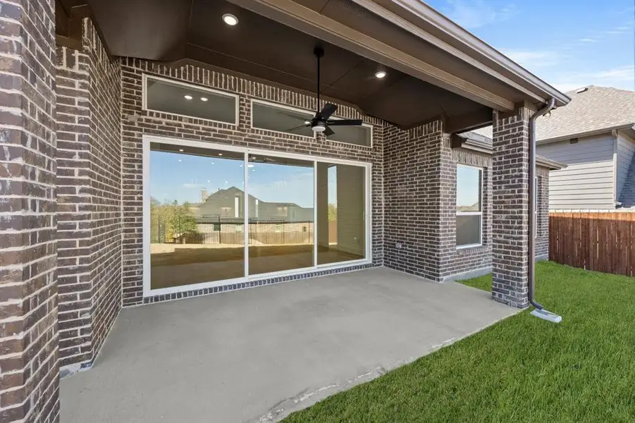 Exterior details and patio area of a home in High Country, Burleson (Image 3).