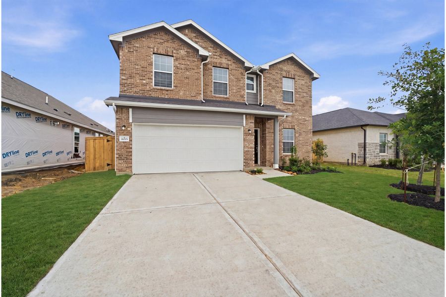 Front exterior of a new home in Ashland, Texas City, TX, highlighting curb appeal (Image 2).