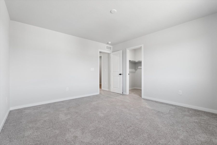 A hallway with white walls. A hallway with white walls.