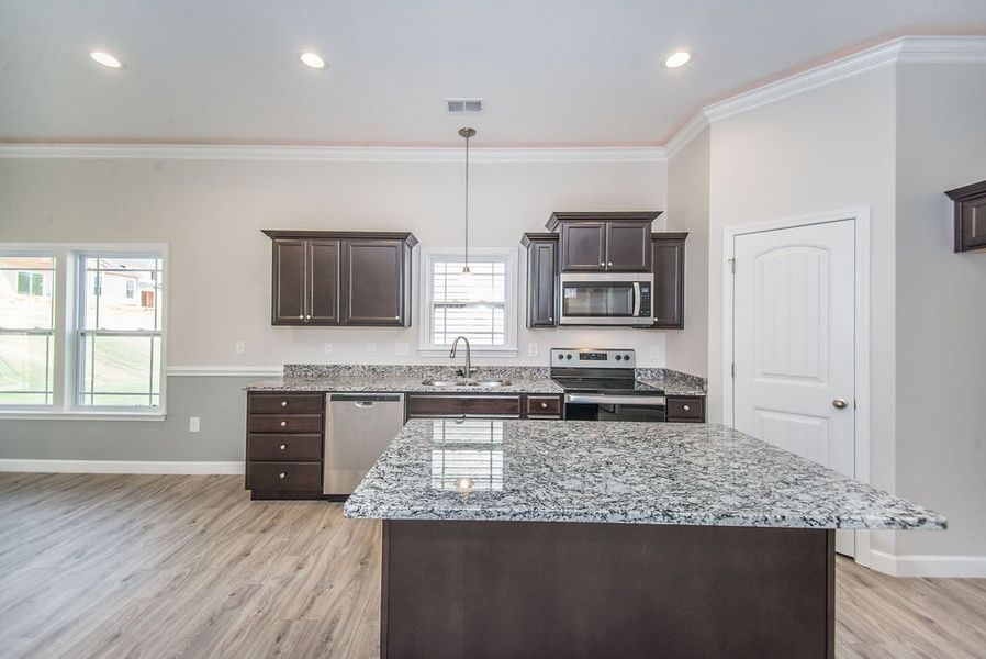 Representative furnished interior of a home built from the Quincy by Enchanted Homes in Lonesome Dove, San Antonio (Image 18).