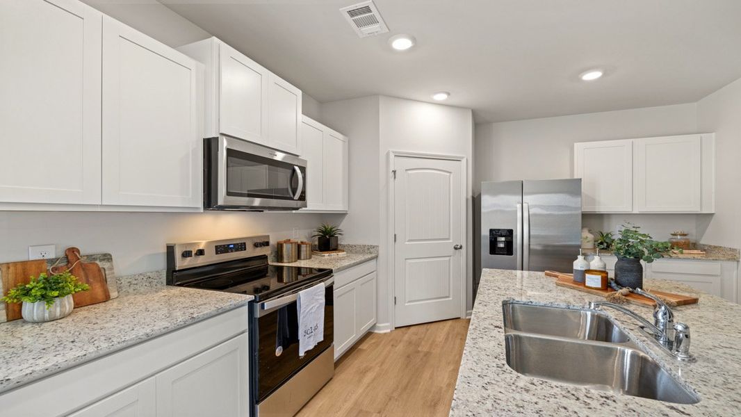Representative furnished interior of a home built from the SUDBURY 24' TOWNHOME by D.R. Horton in Rolling Meadows, Jasper (Image 10).
