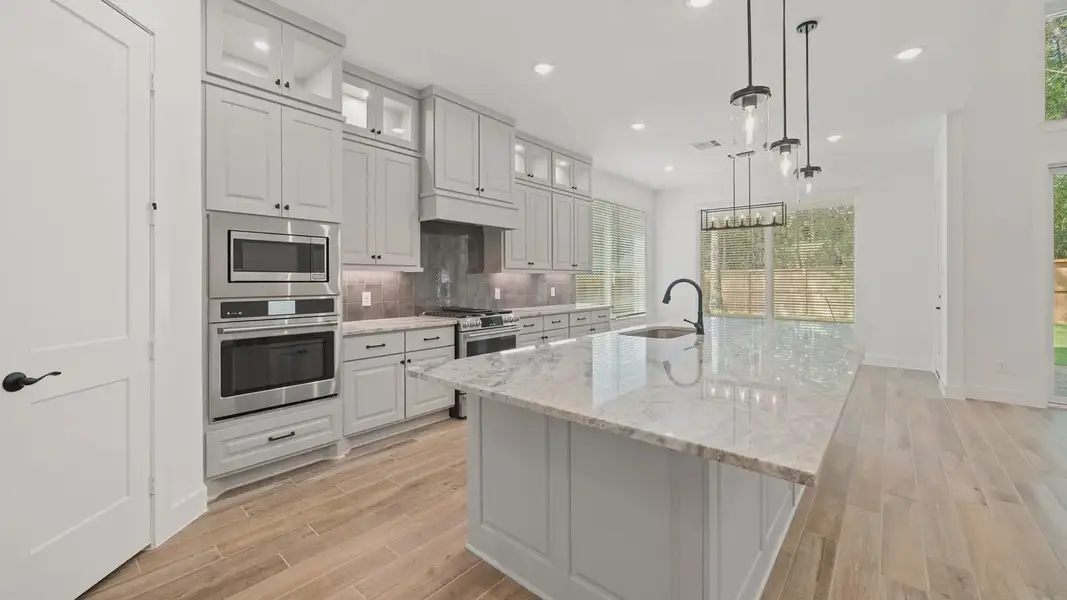 Representative furnished interior of a home built from the Waterloo by Chesmar Homes in Sofi Lakes, Katy (Image 6).