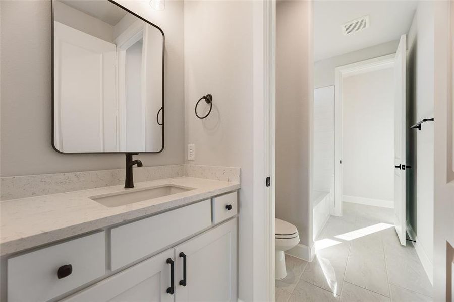 Bathroom with vanity and bathing tub / shower combination Bathroom with vanity and bathing tub / shower combination