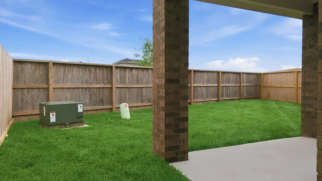 Exterior details and patio area of a home in Lakes at Westland Ranch, League City (Image 2).