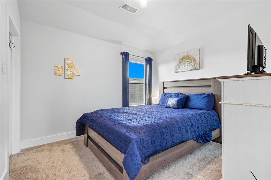 Bedroom with baseboards and carpet floors Bedroom with baseboards and carpet floors