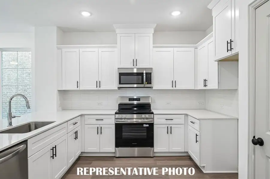 You'll find ample storage and prep space in this delightful kitchen!  REPRESENTATIVE PHOTO
