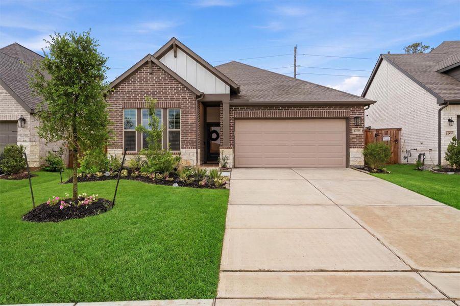 Front exterior of a new home in , Magnolia, TX, highlighting curb appeal (Image 24).