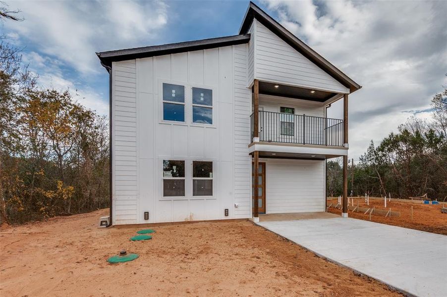 View of front of home with a balcony