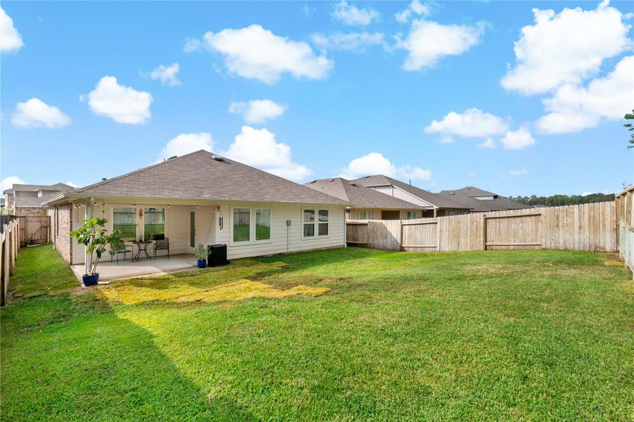 Exterior details and patio area of a home in Harrington Trails at The Canopies, New Caney (Image 2). Exterior details and patio area of a home in Harrington Trails at The Canopies, New Caney (Image 2).