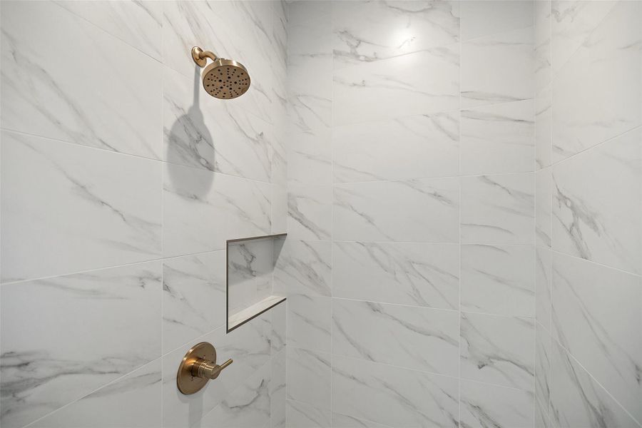 Interior details featuring tiled shower