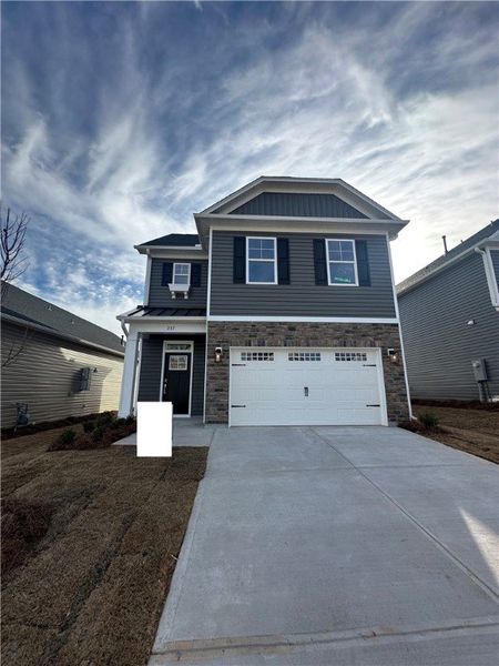 Front exterior of a new home in Brownstone Park, Easley, SC, highlighting curb appeal (Image 1). Front exterior of a new home in Brownstone Park, Easley, SC, highlighting curb appeal (Image 1).