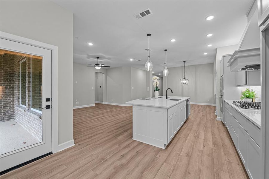 Open, light and bright!  You will love cooking in this kitchen!  Low maintenance vinyl plank floors and 10 ft ceilings!