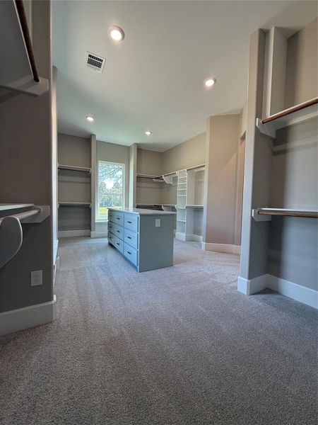 Master Closet with custom island with self close drawers Master Closet with custom island with self close drawers