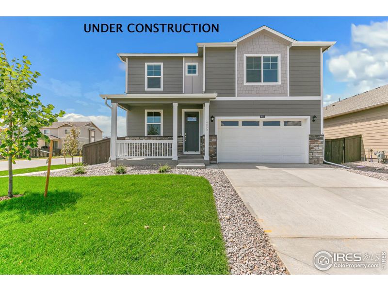 Front exterior of a new home in Settlers Crossing, Commerce City, CO, highlighting curb appeal (Image 1). Front exterior of a new home in Settlers Crossing, Commerce City, CO, highlighting curb appeal (Image 1).