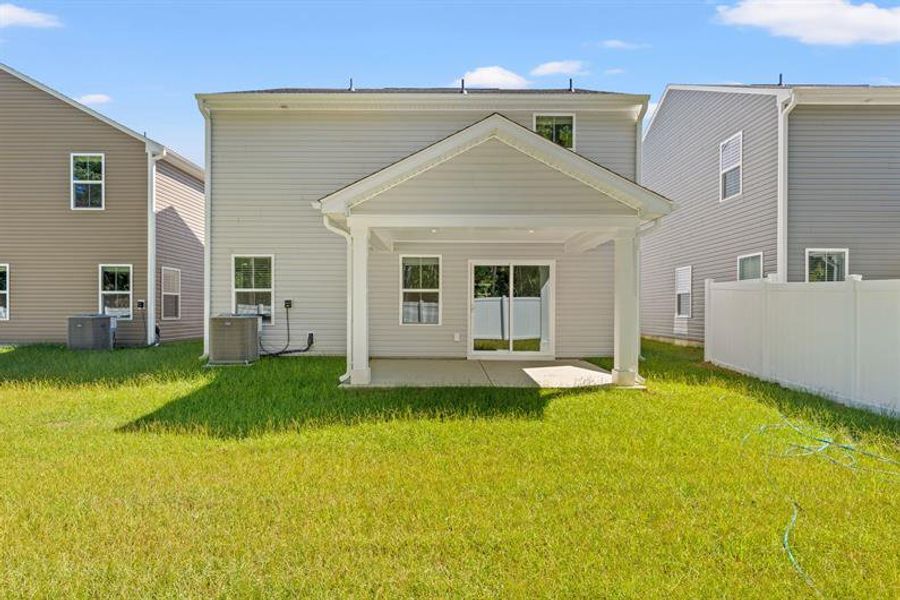 Exterior details and patio area of a home in Bell Creek Single Family Homes, Winnabow (Image 3).