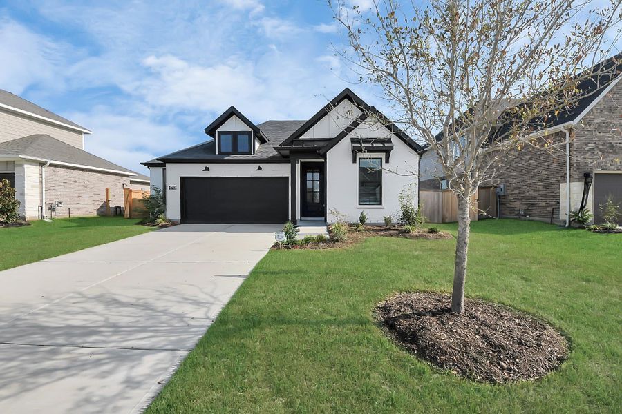 Front exterior of a new home in Arabella on the Prairie: Premier Collection, Richmond, TX, highlighting curb appeal (Image 2). Front exterior of a new home in Arabella on the Prairie: Premier Collection, Richmond, TX, highlighting curb appeal (Image 2).