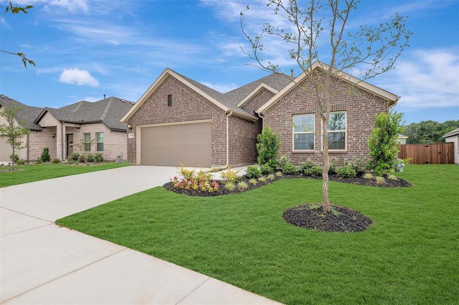 Front exterior of a new home in Kings Way, Denton, TX, highlighting curb appeal (Image 22). Front exterior of a new home in Kings Way, Denton, TX, highlighting curb appeal (Image 22).
