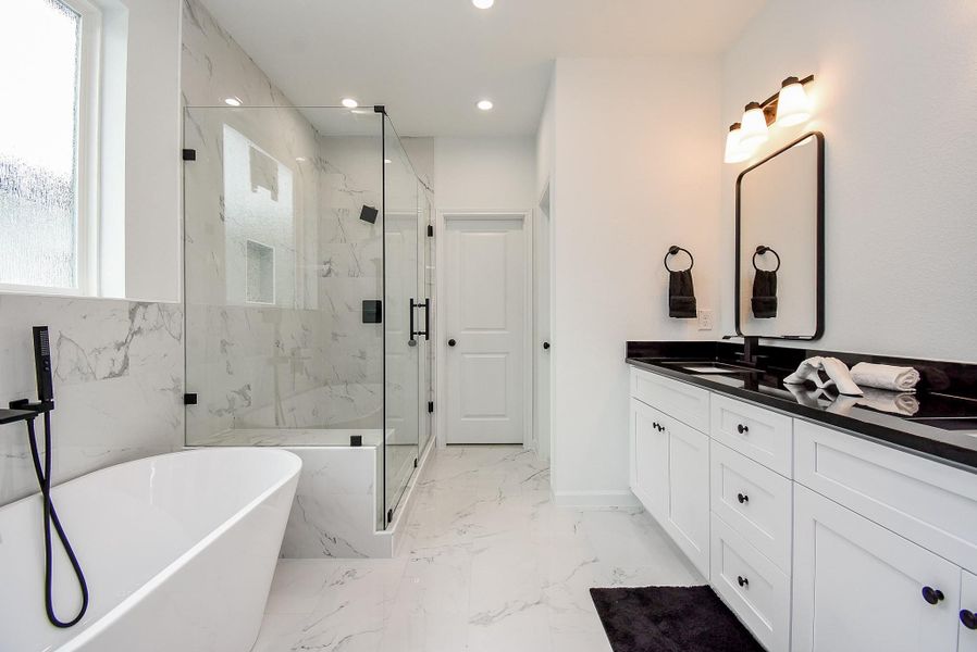 Unwind in a luxurious, spa-like bathroom designed for ultimate relaxation.