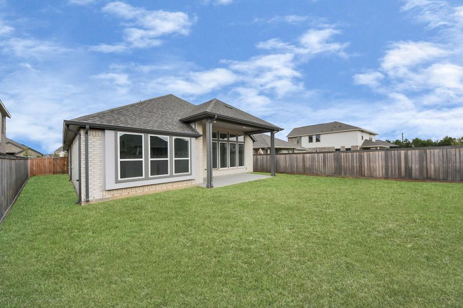 Exterior details and patio area of a home in Bridgeland: Heritage Collection, Cypress (Image 3).