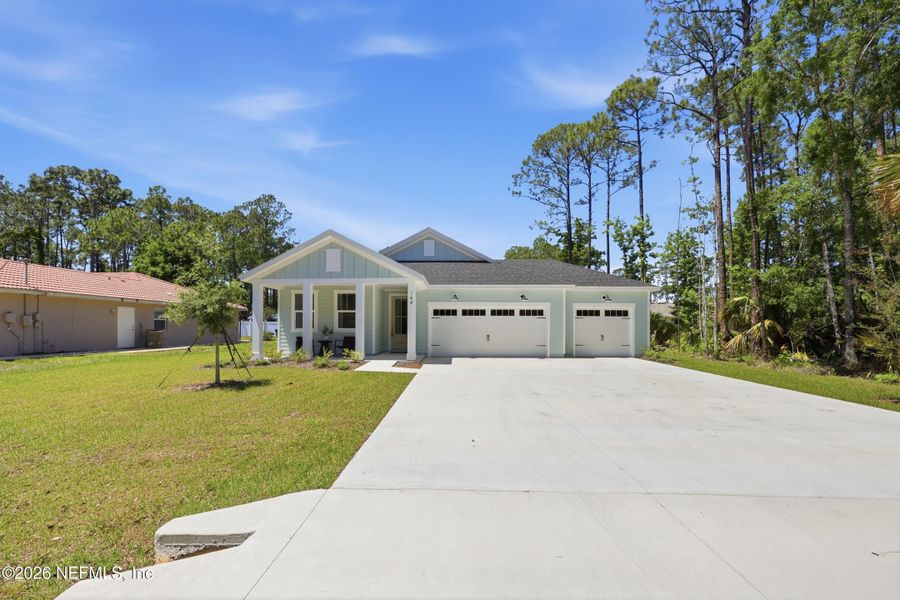 Front exterior of a new home in Palm Coast Homes, Palm Coast, FL, highlighting curb appeal (Image 25).