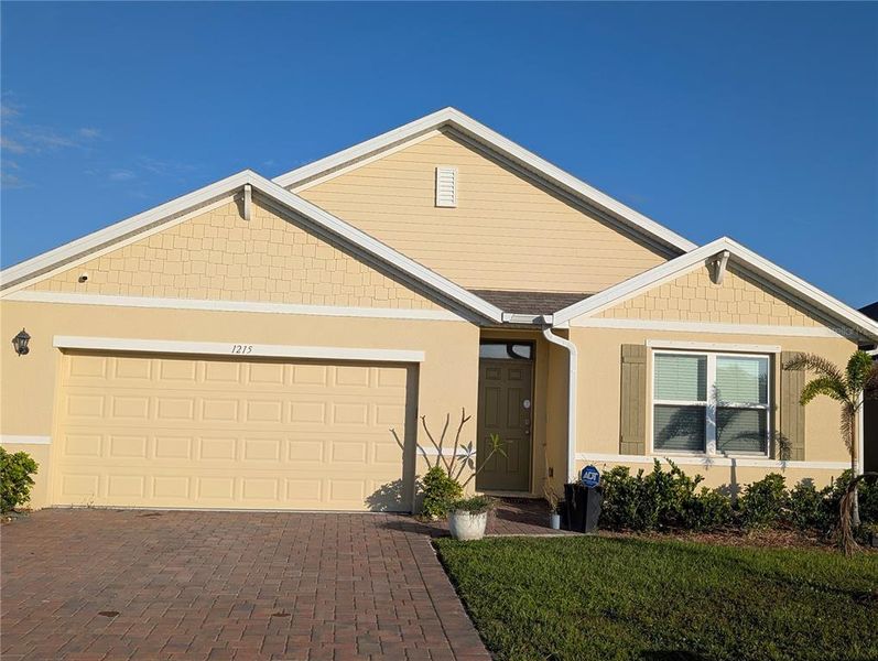 Front exterior of a new home in Cypress Bay West, Palm Bay, FL, highlighting curb appeal (Image 2). Front exterior of a new home in Cypress Bay West, Palm Bay, FL, highlighting curb appeal (Image 2).