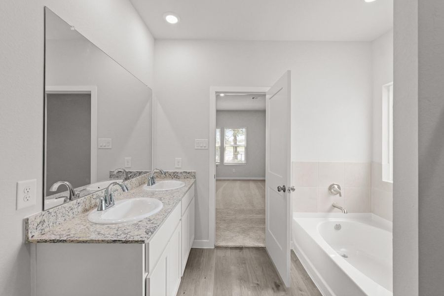 Furnished interior view inside a new home in Lakes at Crockett Martin, Conroe (Image 9).