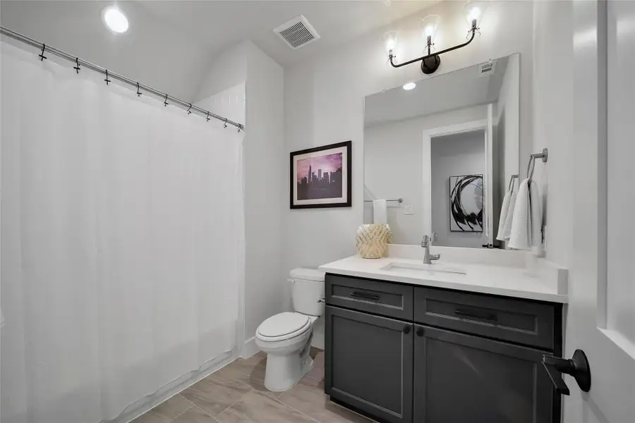 Furnished interior view inside a new home in ARTAVIA, Conroe (Image 6).