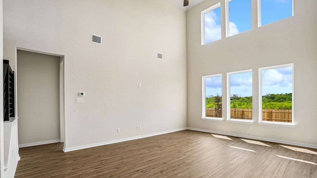 Great Room features picture windows and soaring ceilings