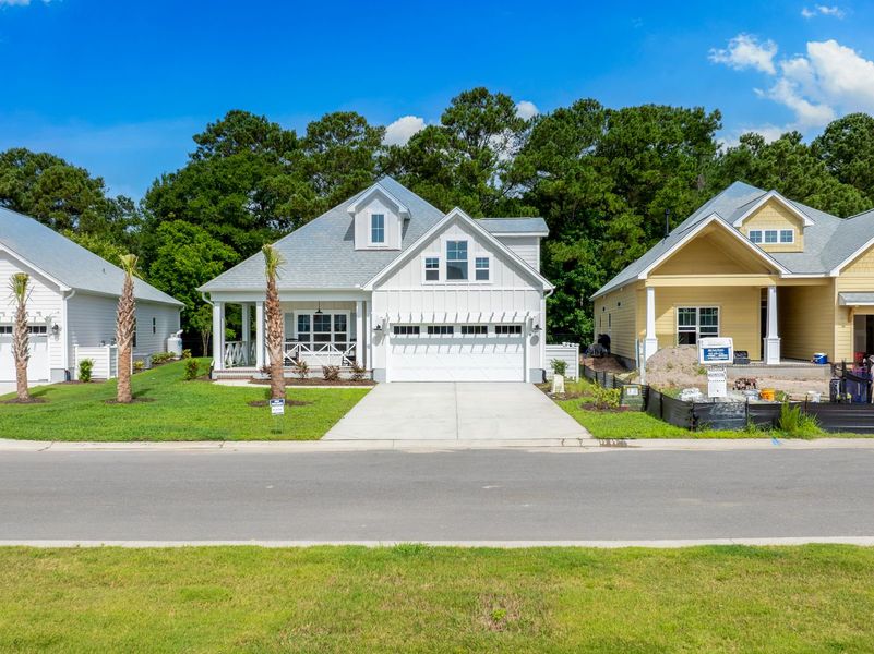 Front exterior of a new home in The Sanctuary at Sunset Beach, Sunset Beach, NC, highlighting curb appeal (Image 26).