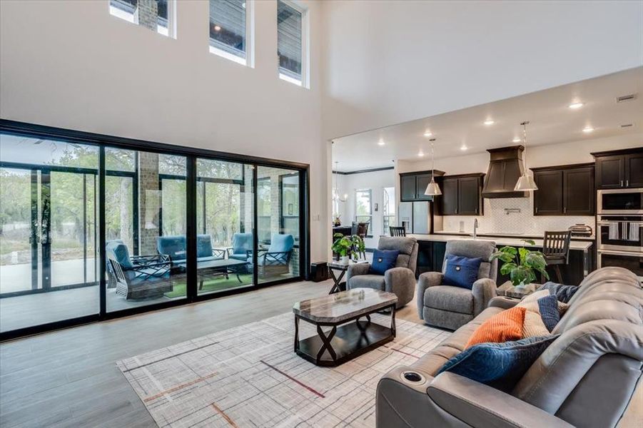 Living area featuring light tile floors and recessed lighting