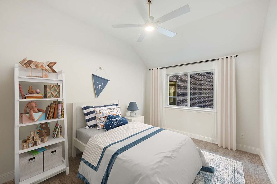 Child's bedroom with vaulted ceiling, ceiling fan, white bookshelf, and single bed with blue accents