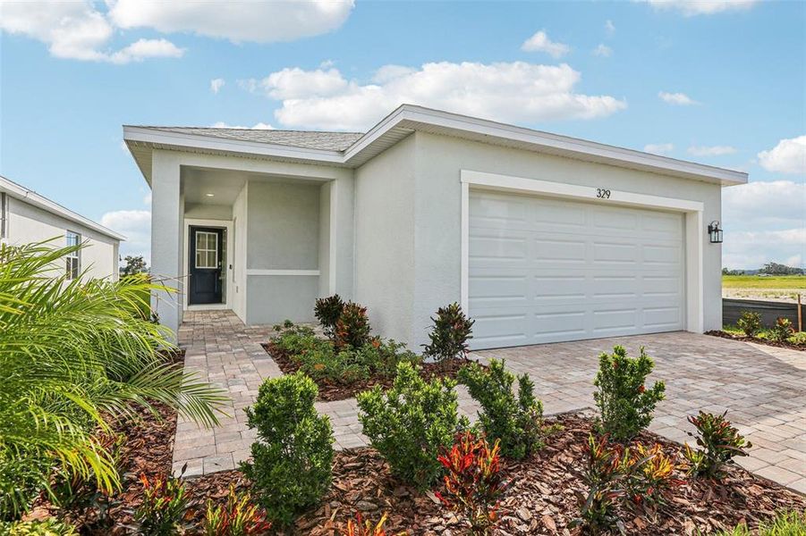 Front exterior of a new home in Willowbrook North, Winter Haven, FL, highlighting curb appeal (Image 21). Front exterior of a new home in Willowbrook North, Winter Haven, FL, highlighting curb appeal (Image 21).