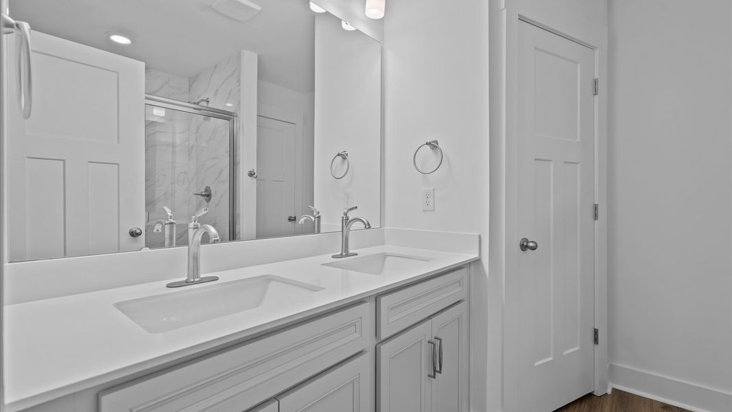 Exceptional en-suite with dual vanity and glass-enclosed, tiled walk-in shower for superior everyday comfort Exceptional en-suite with dual vanity and glass-enclosed, tiled walk-in shower for superior everyday comfort