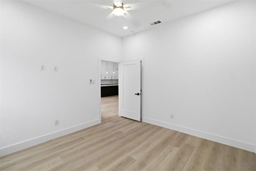 Spare room with wood finished floors, recessed lighting, and ceiling fan