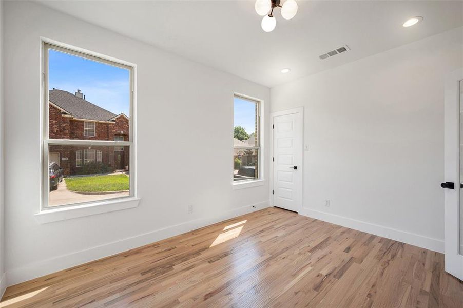Unfurnished room featuring light wood-style flooring and recessed lighting