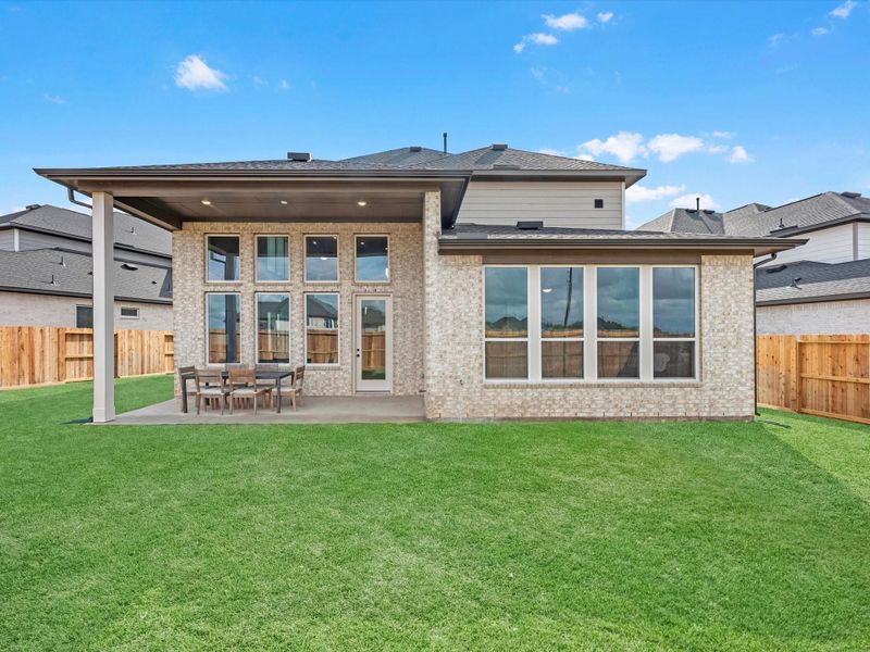 Exterior details and patio area of a home in The Arbor At Pecan Ridge, Fulshear (Image 3).