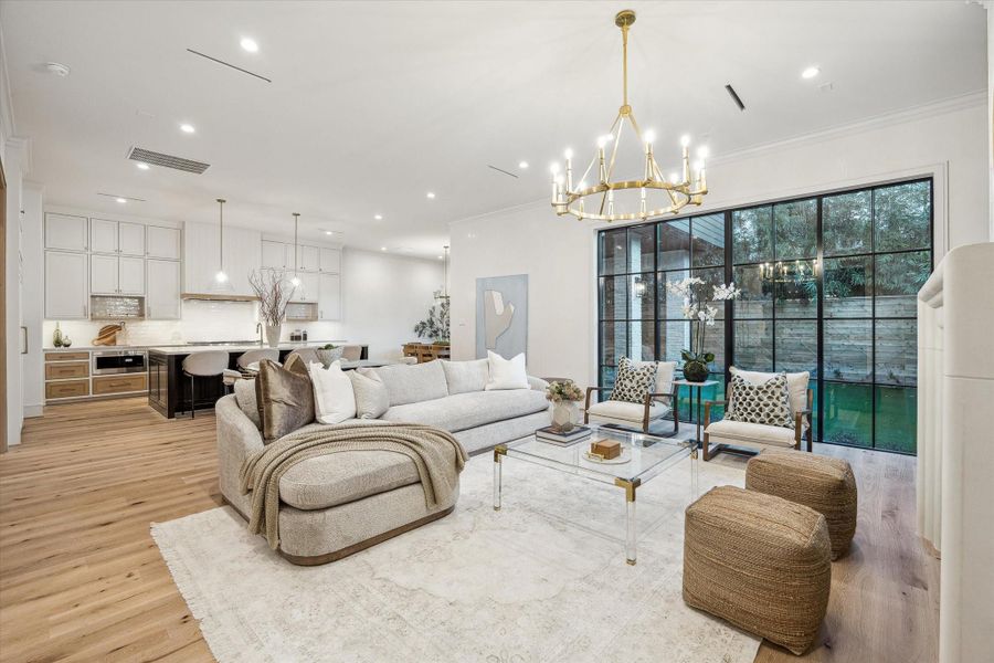 A large, open living space for modern living.  This main public space features 11-foot ceilings, slot-diffuser air conditioning vents, and spectacular Venetian Plaster walls.  Wait until you see it inperson!