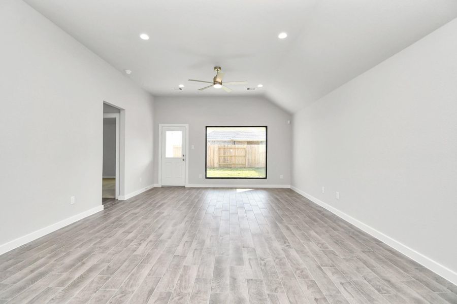 Discover another view of this beautiful family room with a large picture window that allows scenic views.