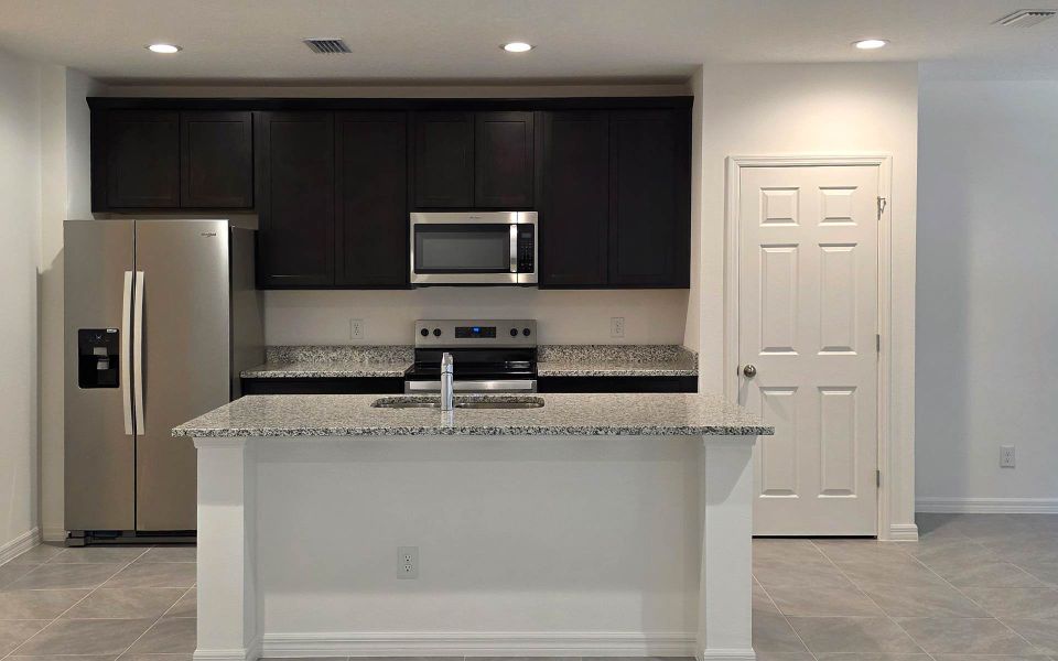 Furnished interior view inside a new home in Blue Springs Reserve Townhomes, Groveland (Image 6). Furnished interior view inside a new home in Blue Springs Reserve Townhomes, Groveland (Image 6).