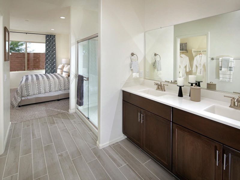 The primary bath boasts dual sinks and a spacious walk in closet.