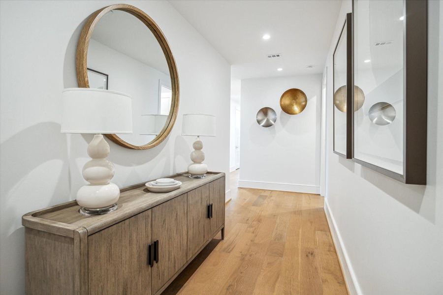 Featuring wide-plank hardwood floors and soaring ceilings, the entryway sets the tone for the home’s Modern style. Featuring wide-plank hardwood floors and soaring ceilings, the entryway sets the tone for the home’s Modern style.