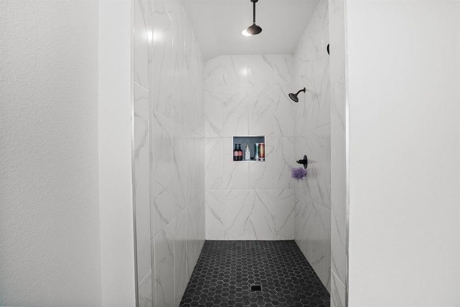 Bathroom with a tile shower Bathroom with a tile shower