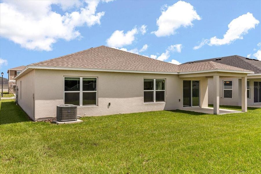 Front exterior of a new home in Reserve at Forest Lake II, Lake Wales, FL, highlighting curb appeal (Image 1). Front exterior of a new home in Reserve at Forest Lake II, Lake Wales, FL, highlighting curb appeal (Image 1).