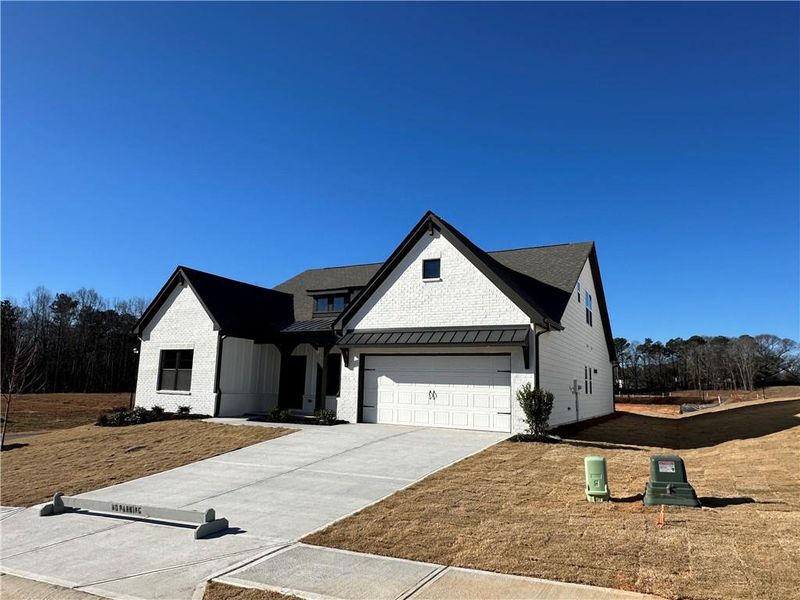 Front exterior of a new home in Summerlin, Winder, GA, highlighting curb appeal (Image 28).