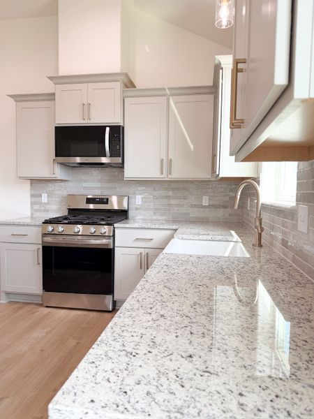 Furnished interior view inside a new home in TerraVista, Victoria (Image 16).
