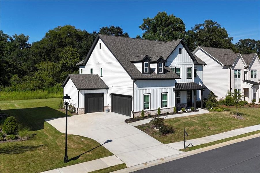 Front exterior of a new home in , Duluth, GA, highlighting curb appeal (Image 2). Front exterior of a new home in , Duluth, GA, highlighting curb appeal (Image 2).