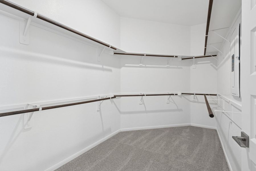 Primary walk-in closet (*Photo not of actual home and used for illustration purposes only.)