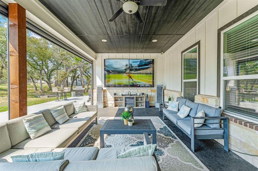 View of patio / terrace featuring ceiling fan, outdoor lounge area, and area for grilling View of patio / terrace featuring ceiling fan, outdoor lounge area, and area for grilling