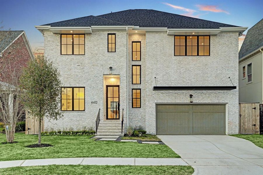 FRONT ELEVATION: Nestled in the heart Bellaire, this new construction brick home boasts a timeless and elegant facade that seamlessly blends classic craftsmanship with modern sensibilities. The meticulously laid brick exterior with symmetrical arrangement of windows exudes a sense of enduring charm, showcasing a rich, warm palette that adds character and sophistication to the streetscape.